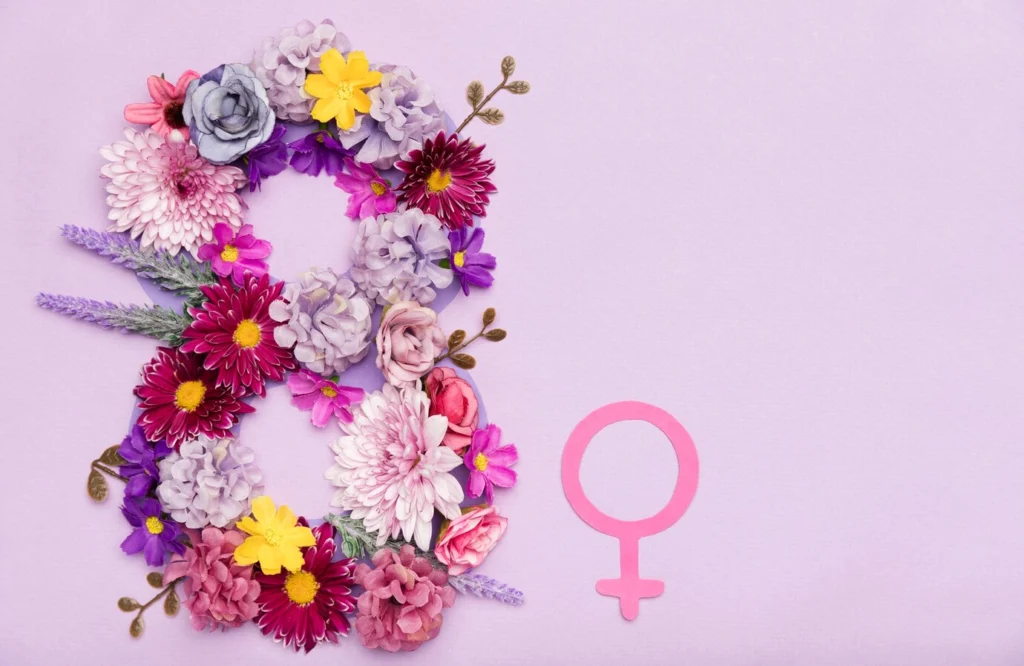 A beautifully crafted floral number 8 with a pink female symbol, honoring women's empowerment and support in Los Angeles.
